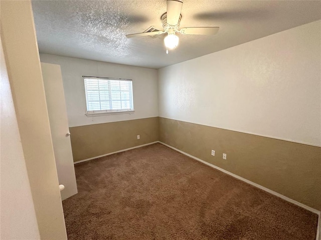 carpeted empty room featuring a textured ceiling and ceiling fan