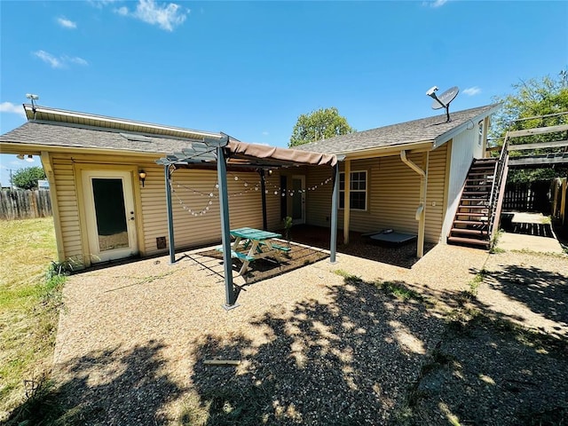 rear view of house with a pergola