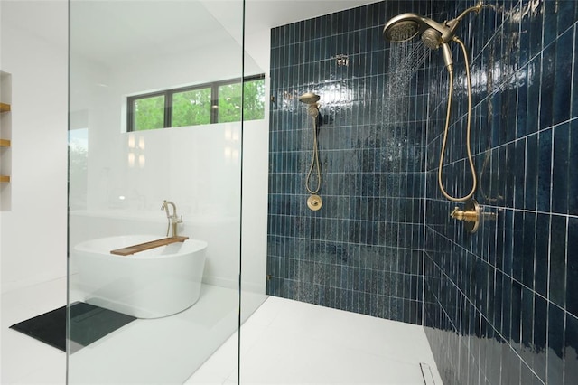 bathroom featuring tile patterned floors and separate shower and tub