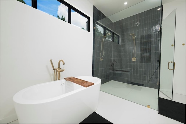 bathroom with separate shower and tub