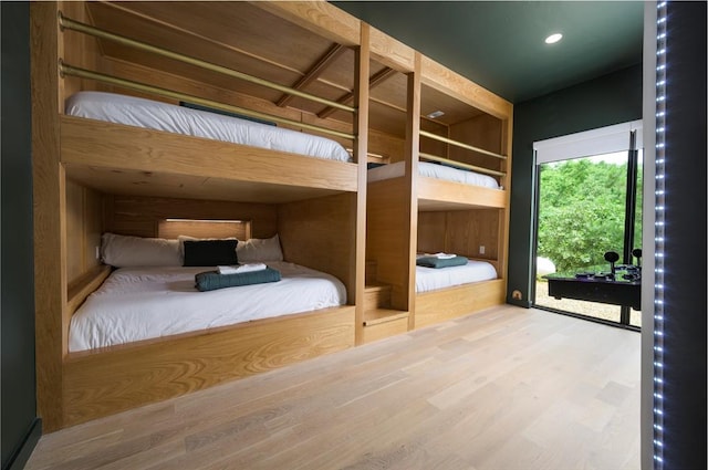 unfurnished bedroom with hardwood / wood-style flooring