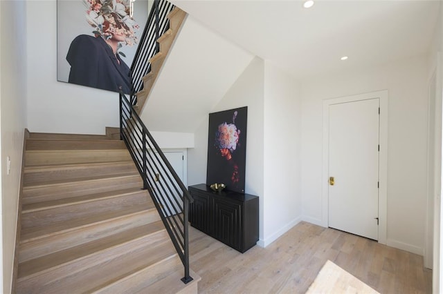 stairs with wood-type flooring