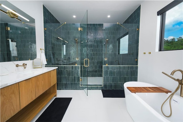 bathroom featuring tile patterned flooring, vanity, and separate shower and tub