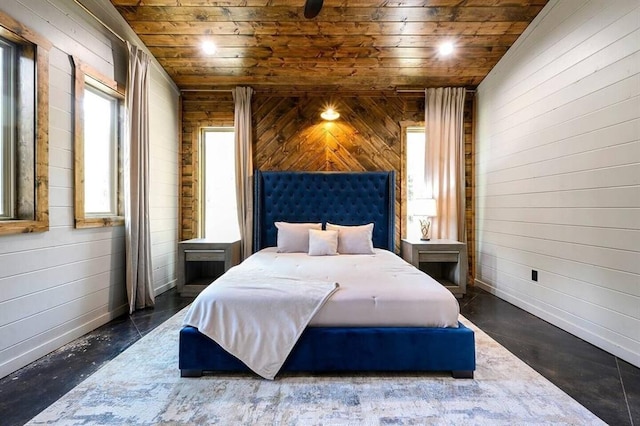 bedroom with wood ceiling, vaulted ceiling, and wood walls