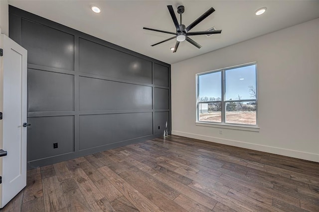 unfurnished bedroom featuring dark hardwood / wood-style flooring and ceiling fan