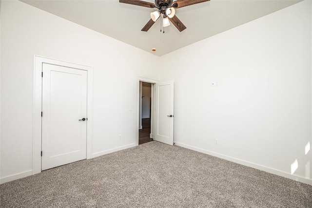 unfurnished bedroom with carpet flooring and ceiling fan