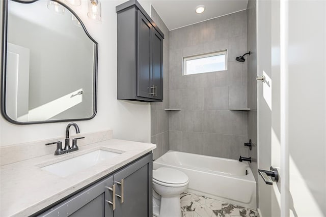 full bathroom with vanity, toilet, and tiled shower / bath combo