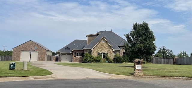 view of front facade with a garage and a front lawn