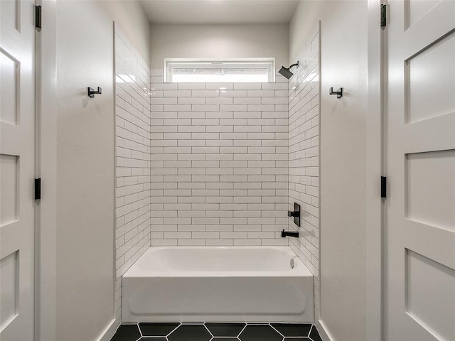 bathroom featuring tile patterned floors and tiled shower / bath combo