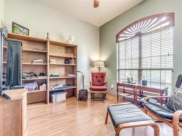 sitting room featuring light hardwood / wood-style flooring and ceiling fan