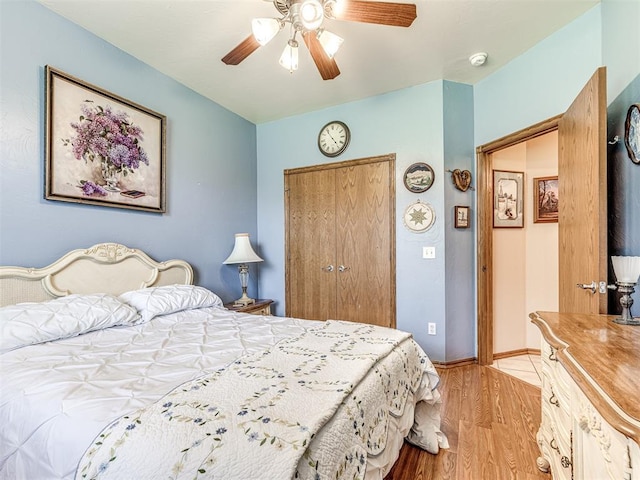 bedroom featuring ceiling fan and light hardwood / wood-style flooring