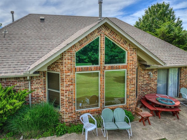 rear view of house with a patio