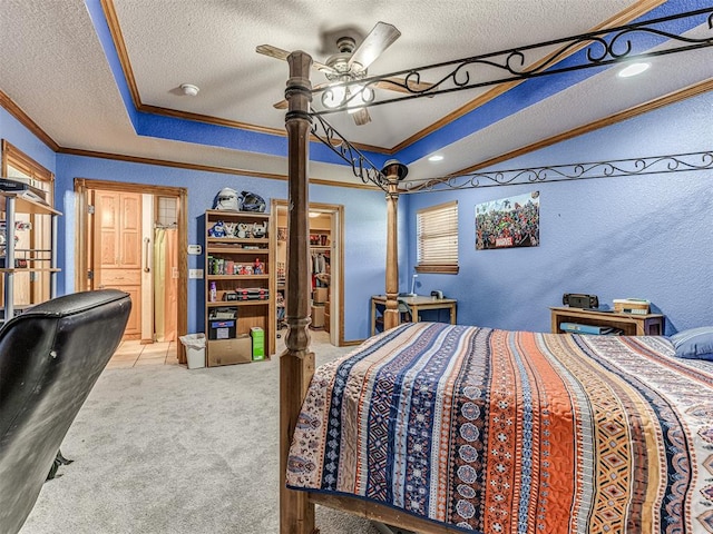 carpeted bedroom featuring ceiling fan, ornamental molding, and a textured ceiling