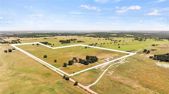 birds eye view of property with a rural view