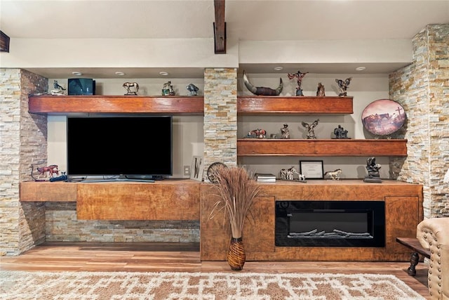 422502 E 1100th Rd, Checotah, OK 74426 - detailed view of wood finished floors, a glass covered fireplace, and beam ceiling