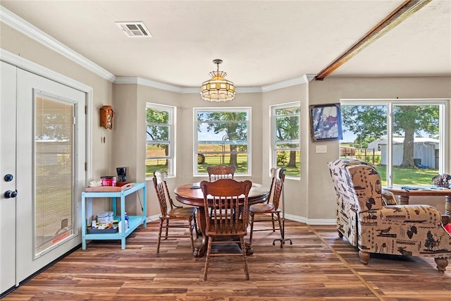 422502 E 1100th Rd, Checotah, OK 74426 - dining area featuring wood finished floors, plenty of natural light, and ornamental molding