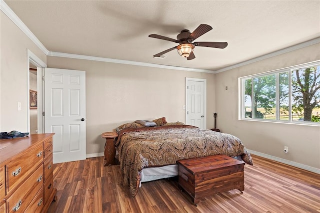 422502 E 1100th Rd, Checotah, OK 74426 - bedroom with wood finished floors, crown molding, and a ceiling fan