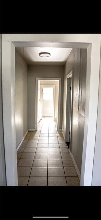 hallway with light tile patterned floors