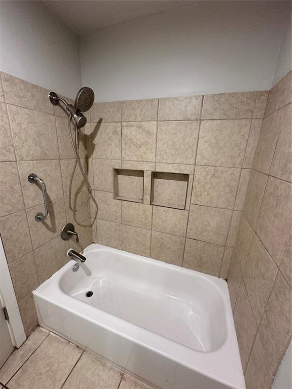 bathroom with tile patterned flooring and tiled shower / bath