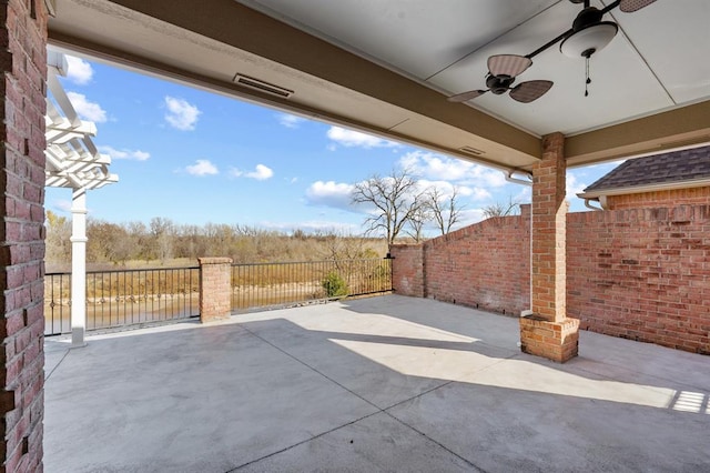 view of patio featuring ceiling fan