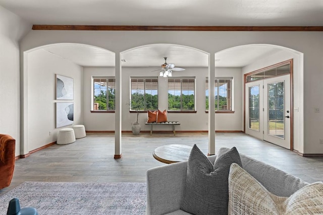 living room featuring ceiling fan and light wood-type flooring