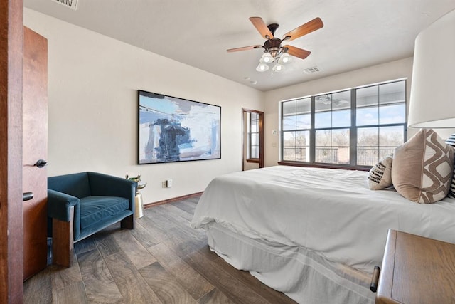 bedroom featuring hardwood / wood-style floors and ceiling fan