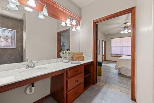 bathroom with ceiling fan, sink, and hardwood / wood-style flooring