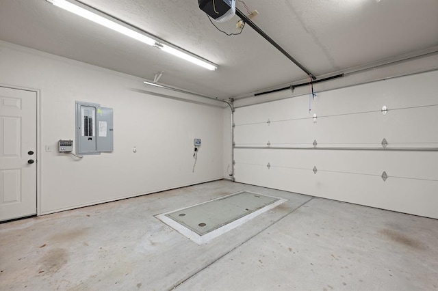 garage featuring electric panel and a garage door opener