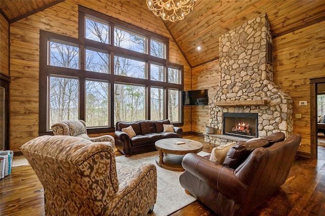 living room featuring a fireplace, high vaulted ceiling, dark wood-type flooring, and wood ceiling