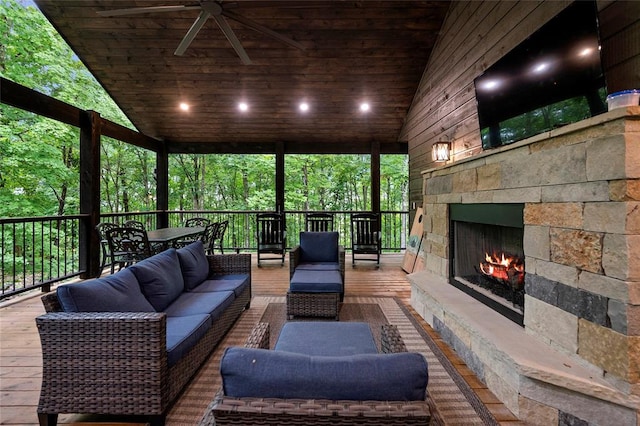 exterior space with an outdoor stone fireplace and lofted ceiling