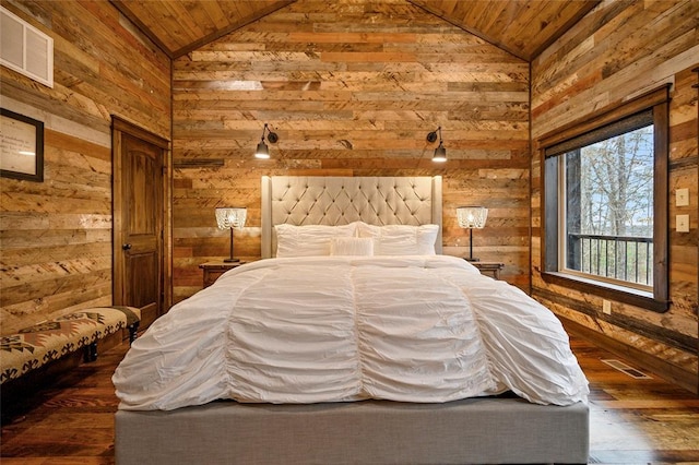 bedroom featuring wooden walls, dark wood-type flooring, wooden ceiling, and vaulted ceiling