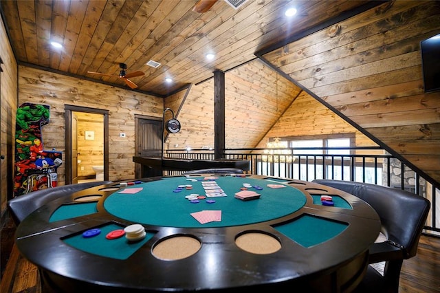 game room featuring ceiling fan, wood walls, wood ceiling, and vaulted ceiling