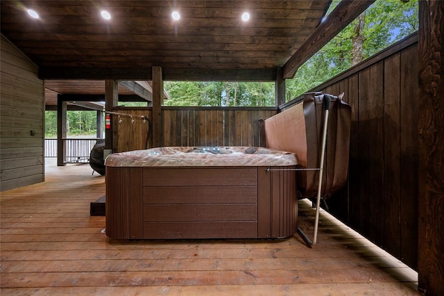 wooden terrace with a hot tub