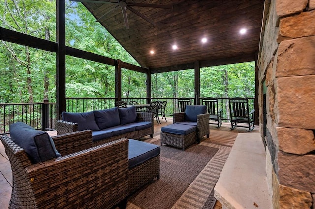 exterior space featuring an outdoor living space and ceiling fan