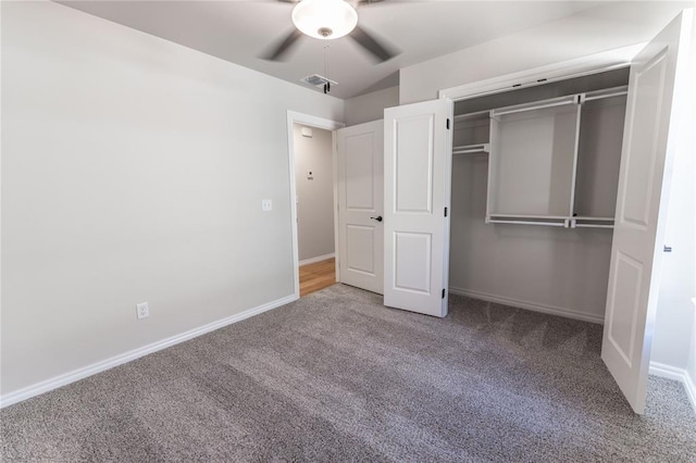 unfurnished bedroom with carpet flooring, a closet, and ceiling fan