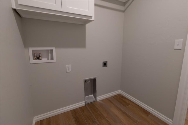 clothes washing area with washer hookup, electric dryer hookup, cabinets, and wood-type flooring