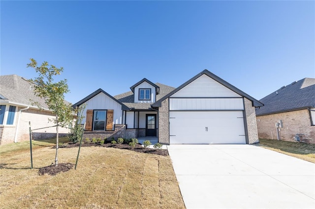 view of front of house with a garage and a front yard