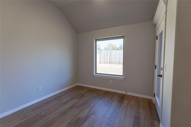 unfurnished room with lofted ceiling and light hardwood / wood-style flooring