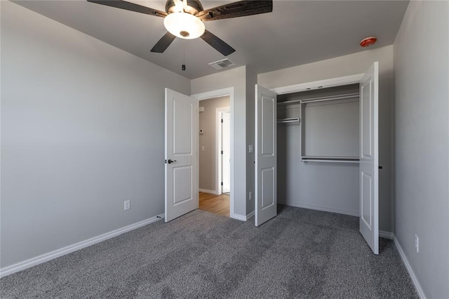 unfurnished bedroom featuring carpet flooring, a closet, and ceiling fan