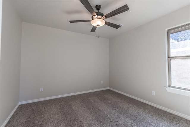 empty room with carpet and ceiling fan