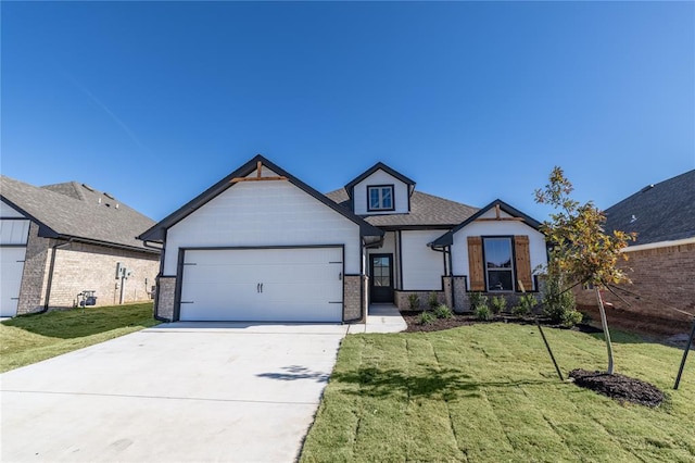 craftsman-style house with a garage and a front lawn