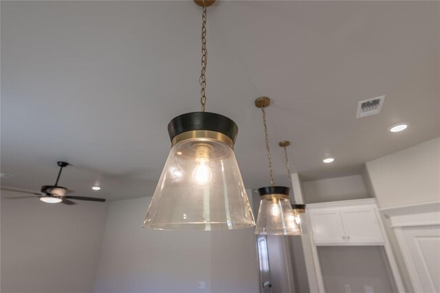 interior details featuring ceiling fan