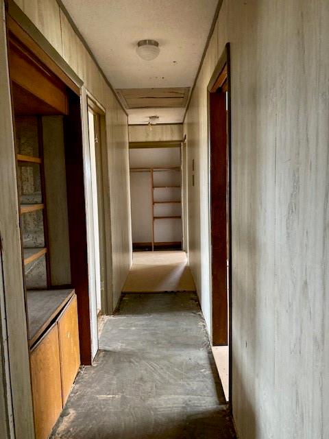 hallway featuring concrete flooring