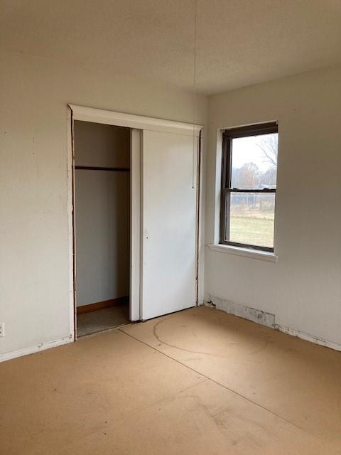 unfurnished bedroom with a closet