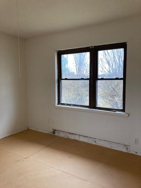 unfurnished room featuring a wealth of natural light