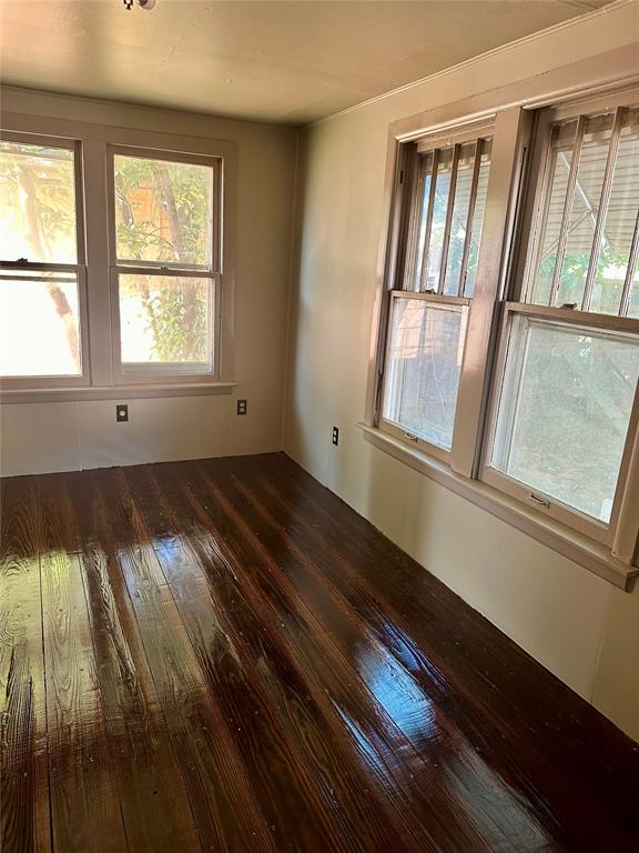 unfurnished room featuring dark hardwood / wood-style floors