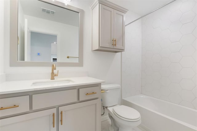 full bathroom featuring vanity, toilet, and tiled shower / bath