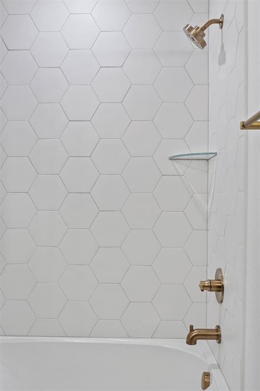 details with tiled shower / bath combo