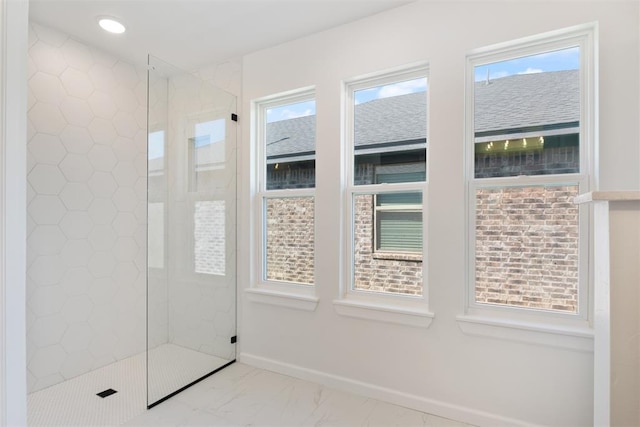 bathroom with a tile shower