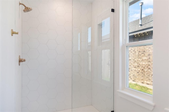 bathroom with a tile shower